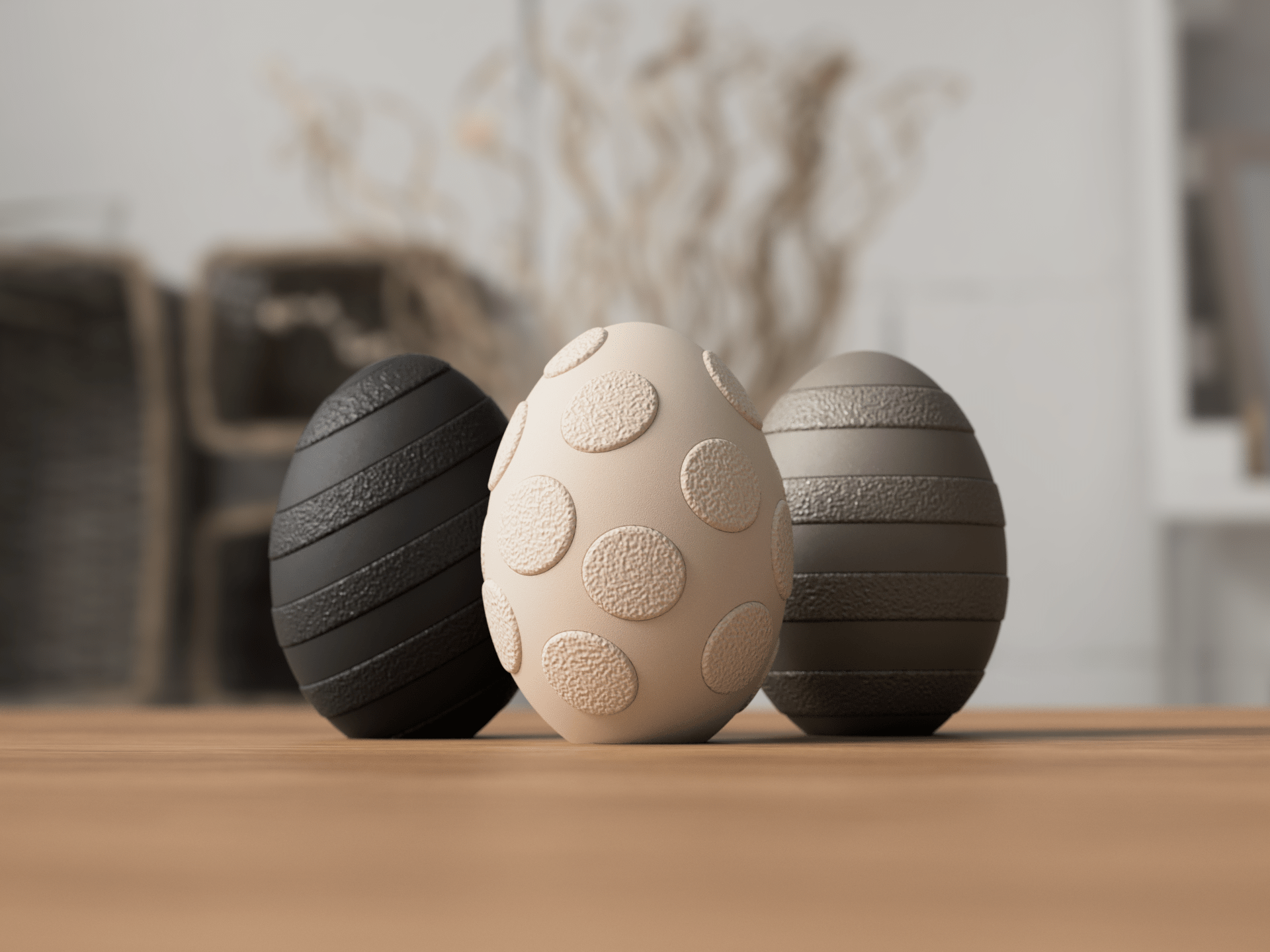 Tre fuzzy påskeæg med prikket mønster i sort, beige og grå - nordisk påskepynt i PLA