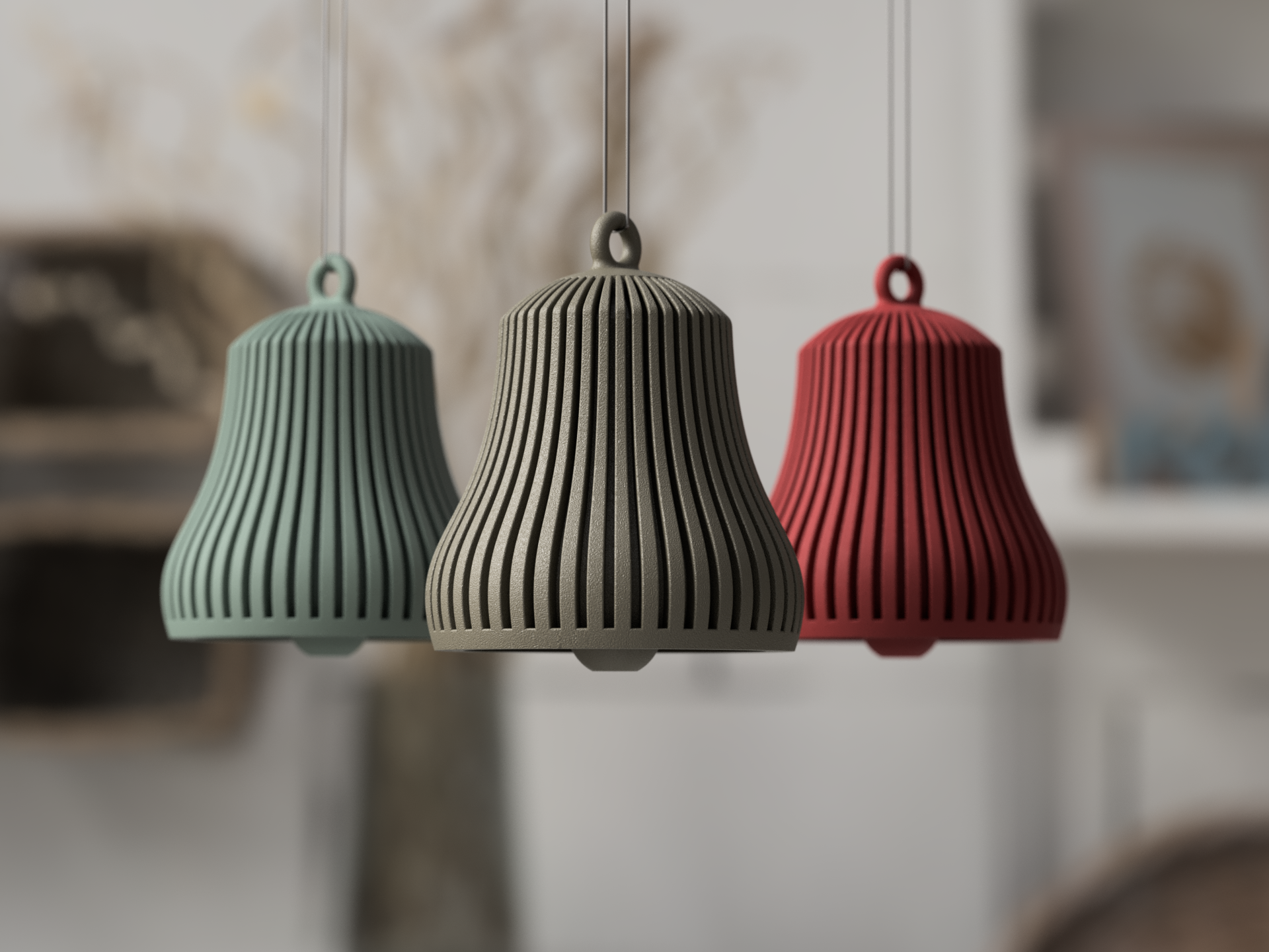 Tre funktionelle juleklokker i muted green, latte brun og mørk rød ribbet PLA hængende på gren – minimalistisk julepynt fra Homae