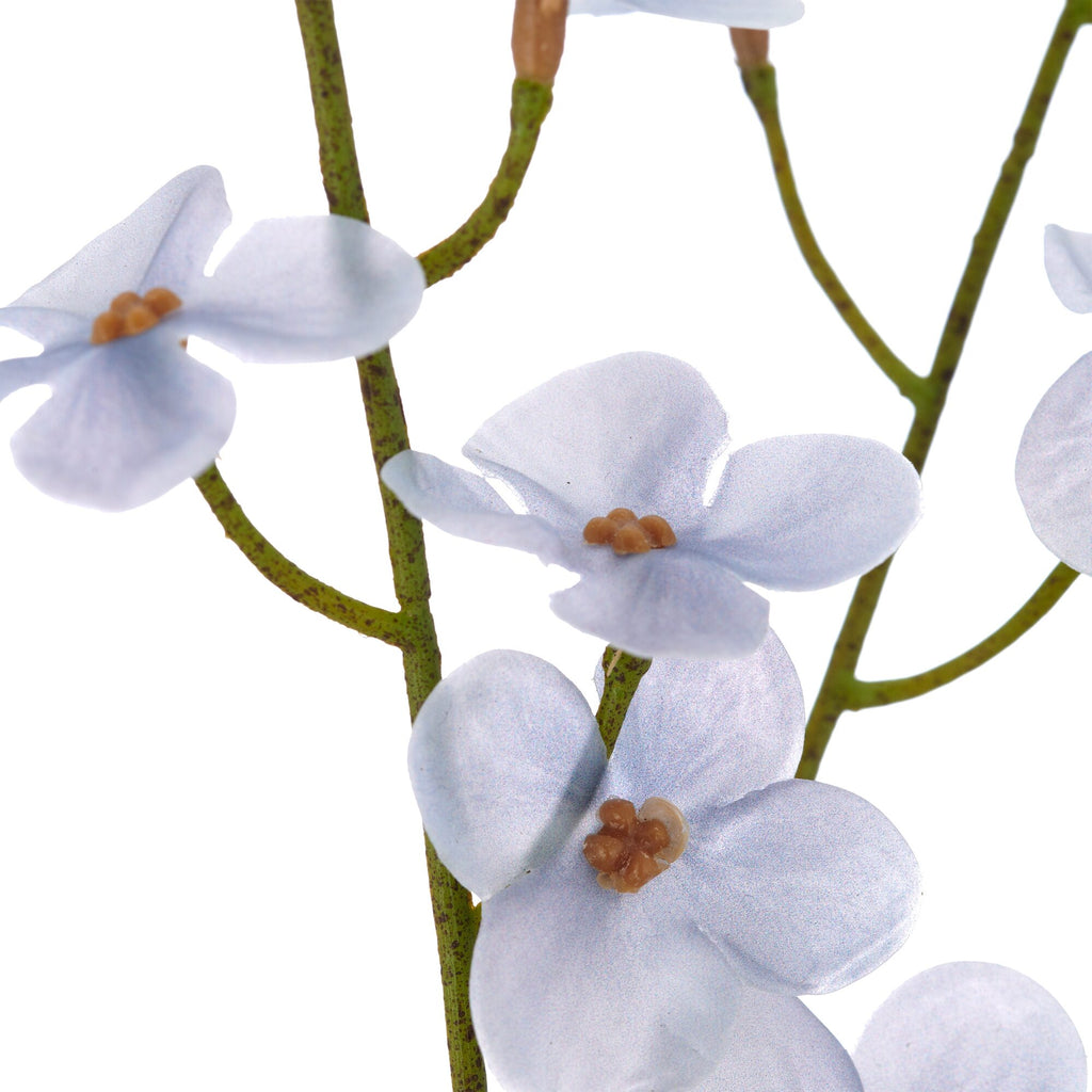 Nærbillede af kunstig cornus gren i lys blå med små blomster