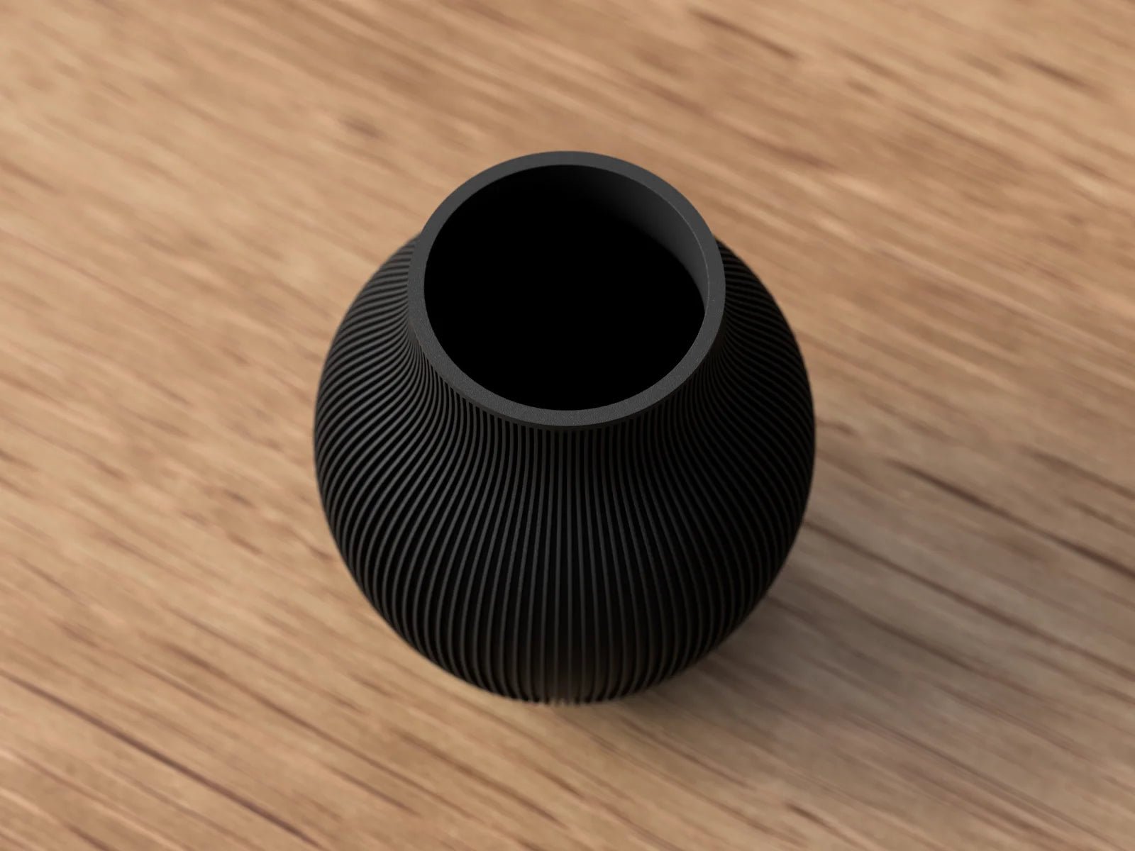 Tayo vase i koks sort mat set oppefra med rund åbning og ribbet overflade